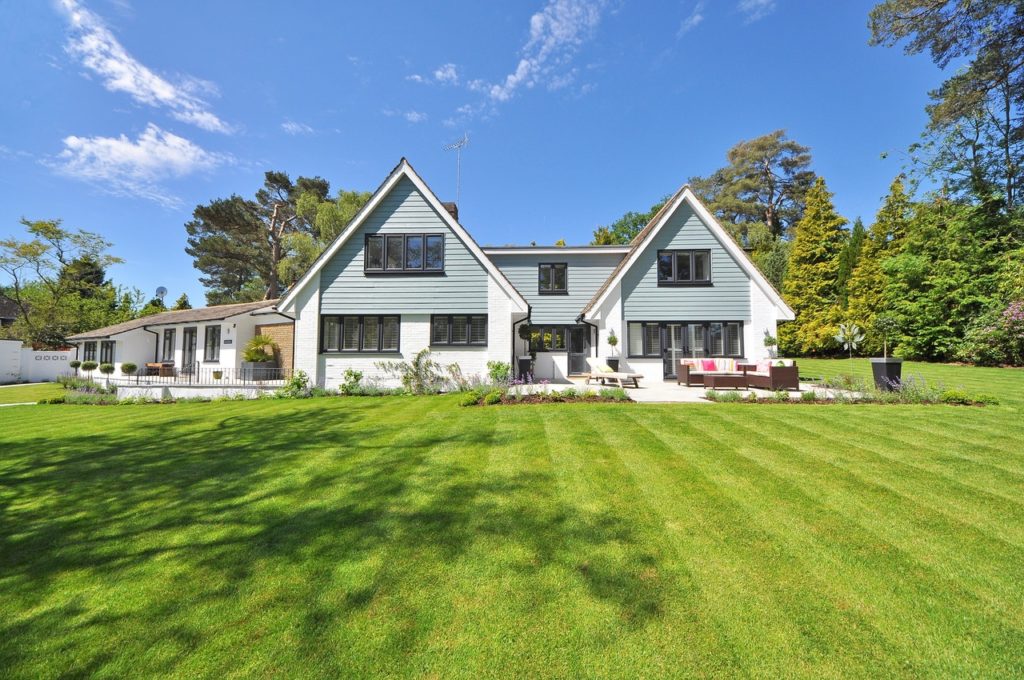 A home sits on a well-manicured lawn.