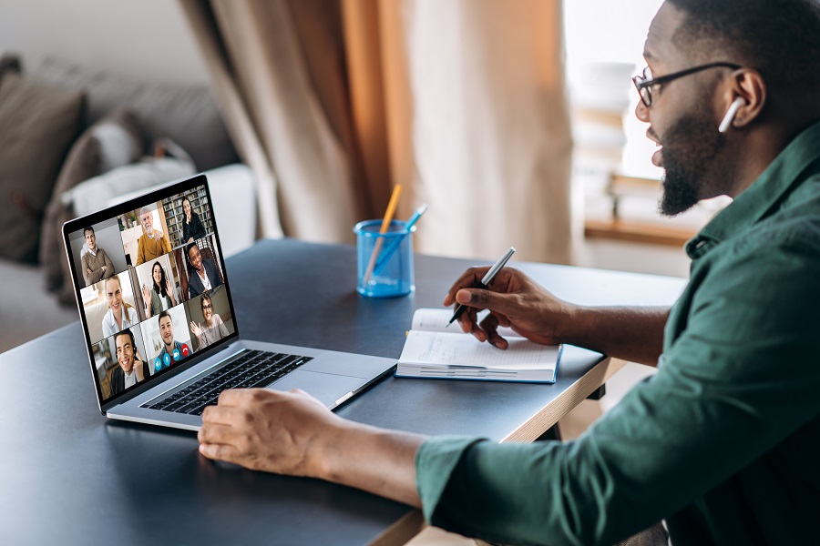 A remote worker sitting in his home on a video call.