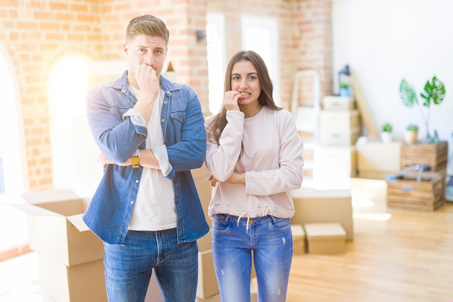 Buyers of a home looking nervous and uncertain